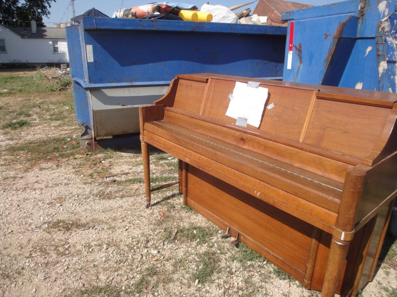 Piano in the trash